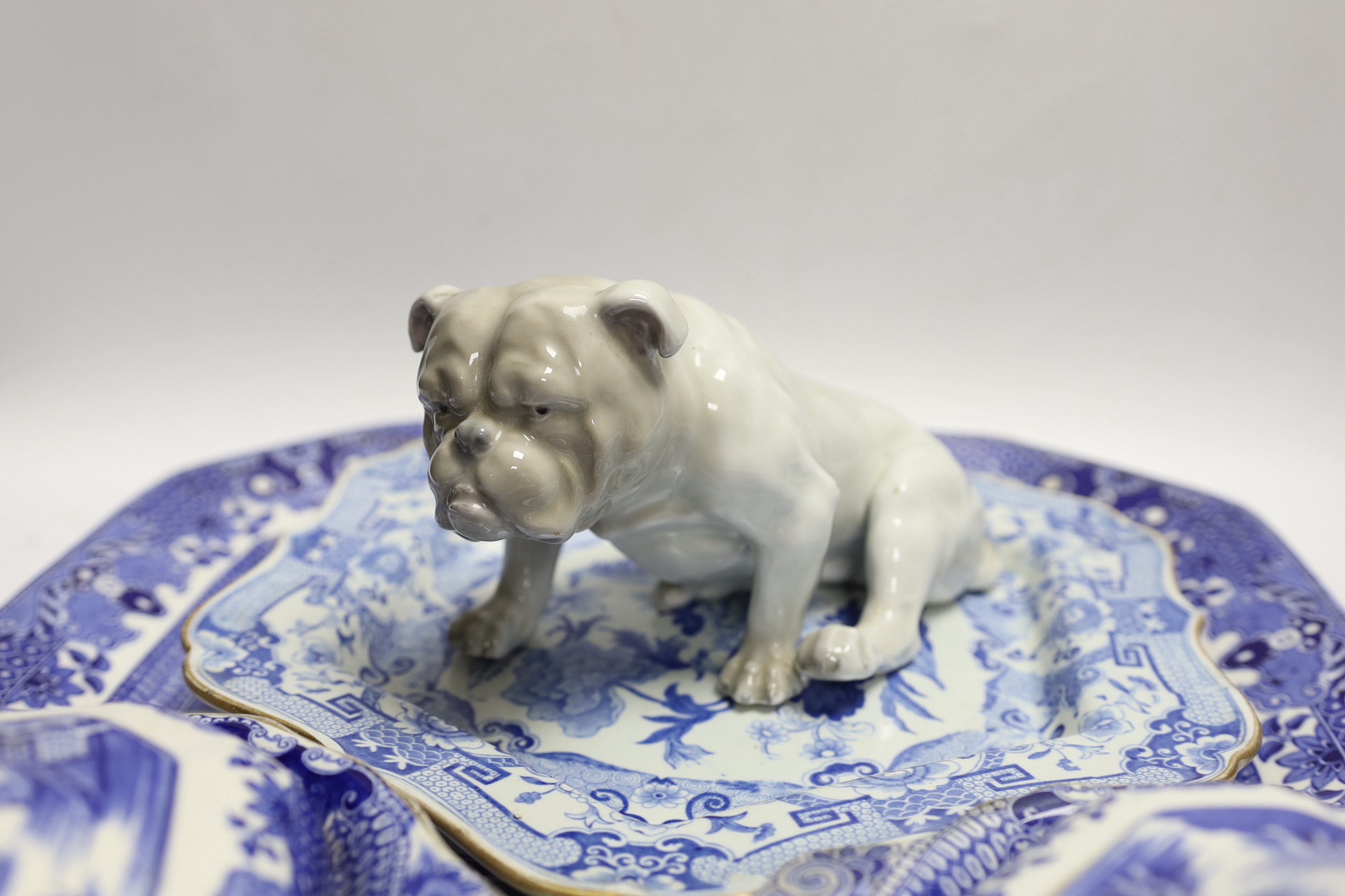 A Mason's stoneware blue and white plate, 2 tureens and a serving dish and a German model of a pug dog